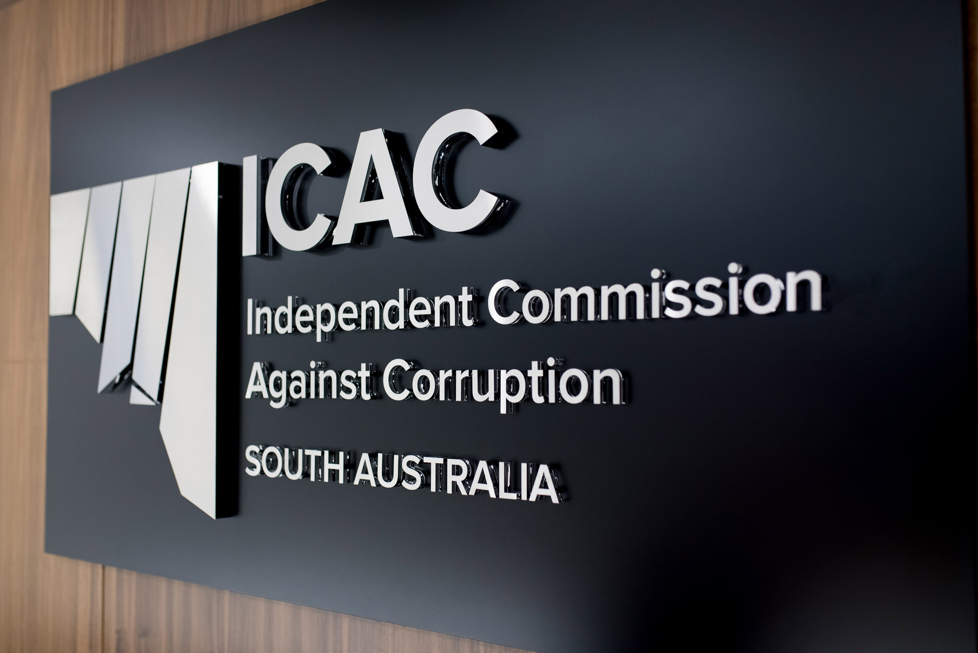 Photo of the Independent Commission Against Corruption logo from hearing room